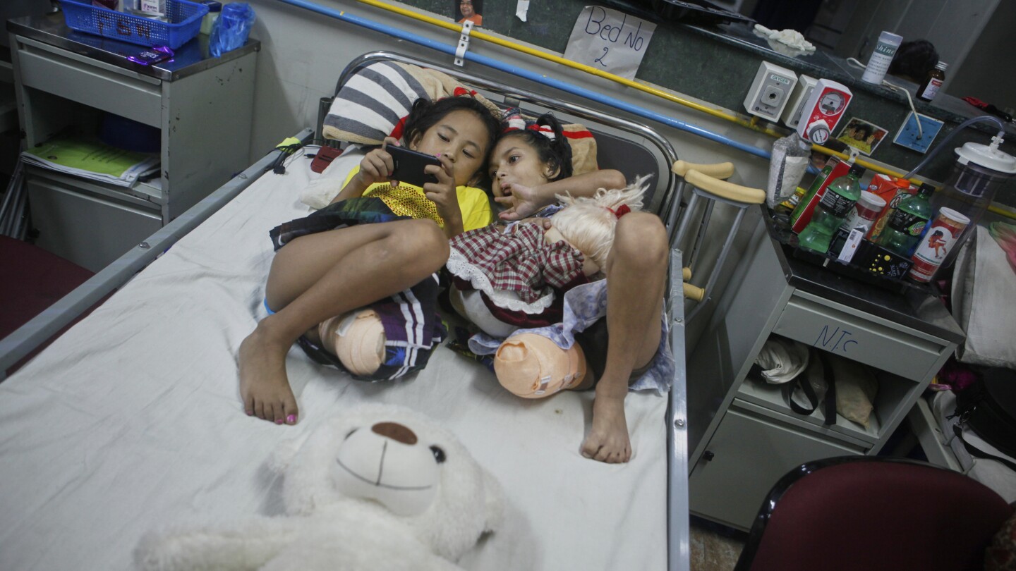 The two girls survived the 2015 earthquake in Nepal. Each of them lost their legs, but found friendship in the hospital.